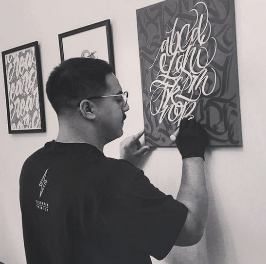 Gianni working on calligraphy
